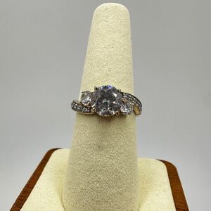 Diamonesk 8mm round cut cz w/ accent cz diamonds in two toned, stamped 925 ring!